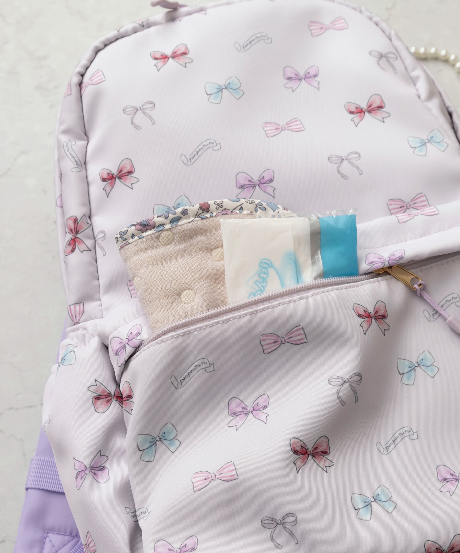 撥水マルチポケットリュック/リボンパレード