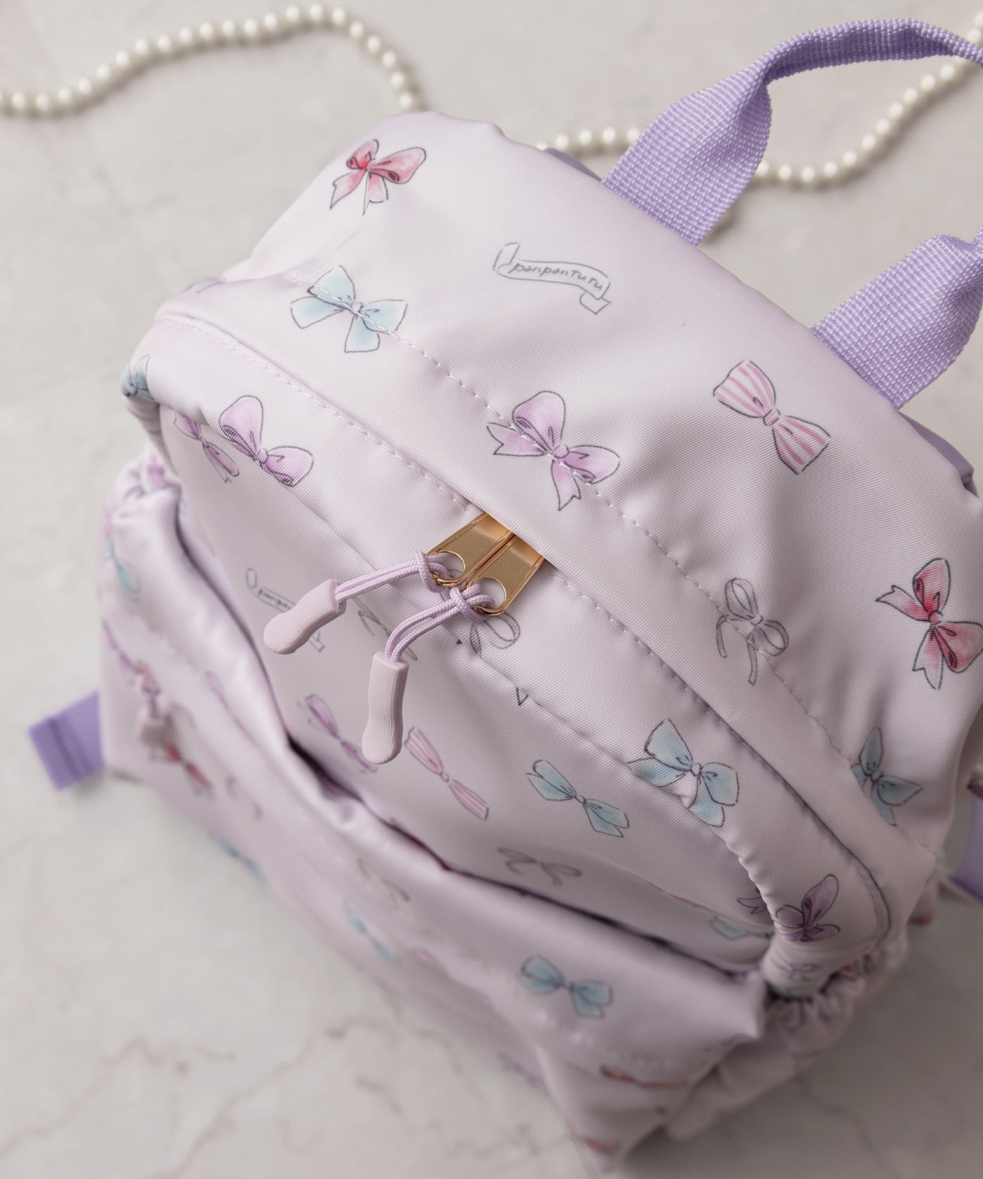 撥水マルチポケットリュック/リボンパレード